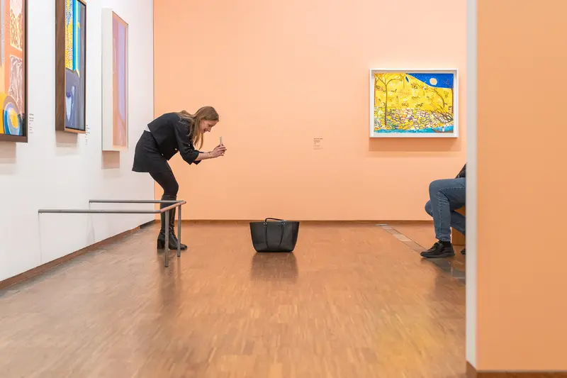Visitor Examining Van Gogh Artwork at Albertina Museum Exhibition