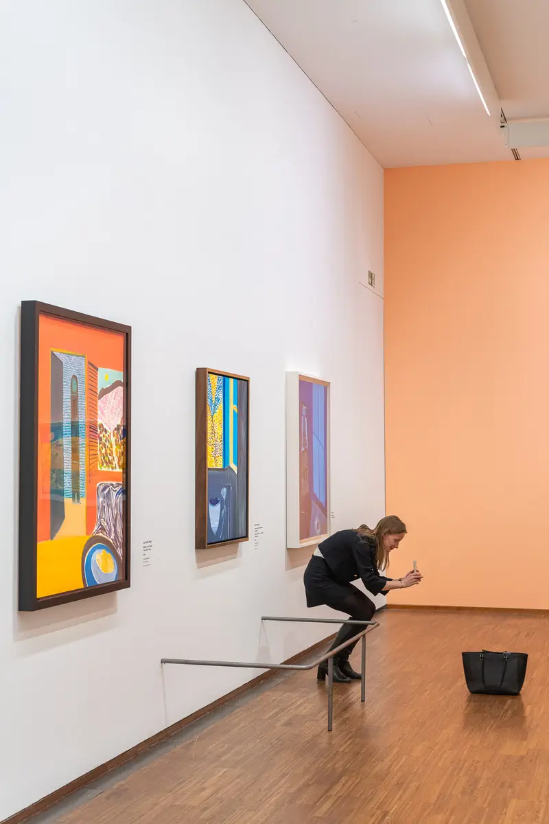 Visitor Studying Colorful Artworks at Exhibition Wong - Van Gogh at Albertina