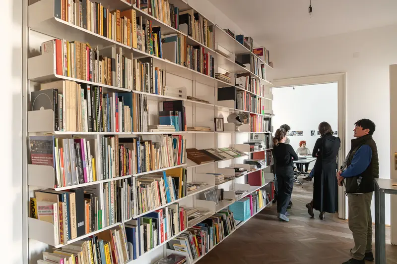 Valie Export and Felix Hoffmann Discussing Art at Archival Bookshelf