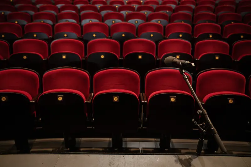 Empty Red Seats and Microphone at Volkstheater Stage Backstage