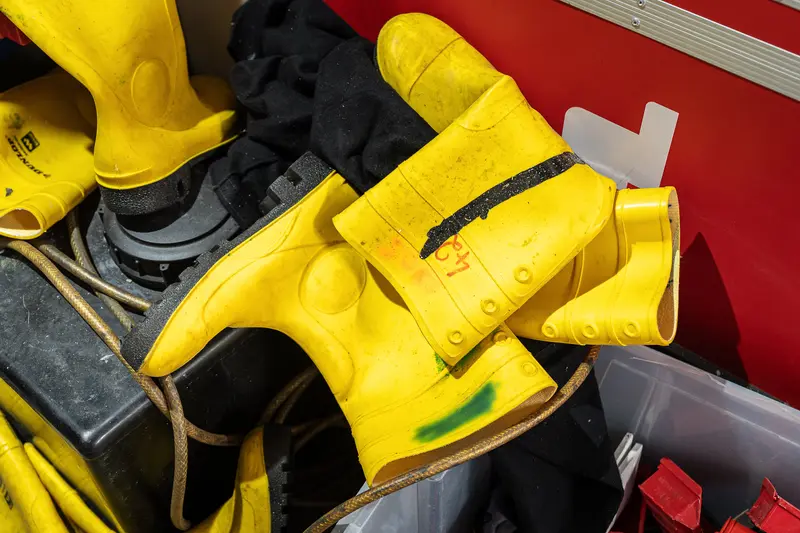 Yellow Safety Gloves and Equipment in Industrial Workshop Setting