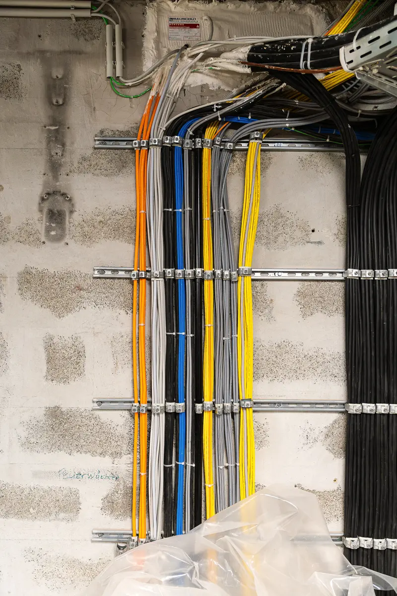 Complex Network of Color-Coded Electrical Cables in Technical Installation