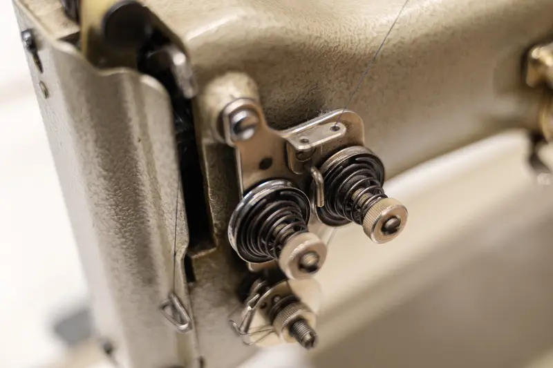 Precision Mechanism: Industrial Sewing Machine Close-Up Detail