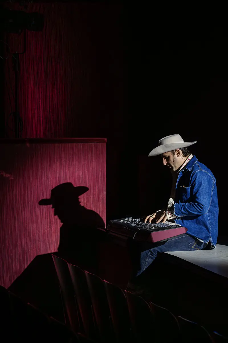 Shadow and Performer at "Of Mice and Men" Theater Production