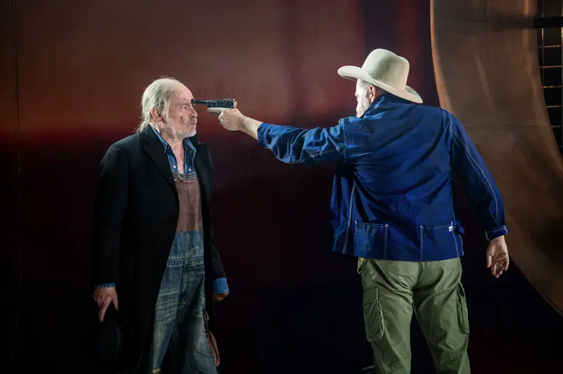 Tense Confrontation in Theatrical Performance of "Of Mice and Men"