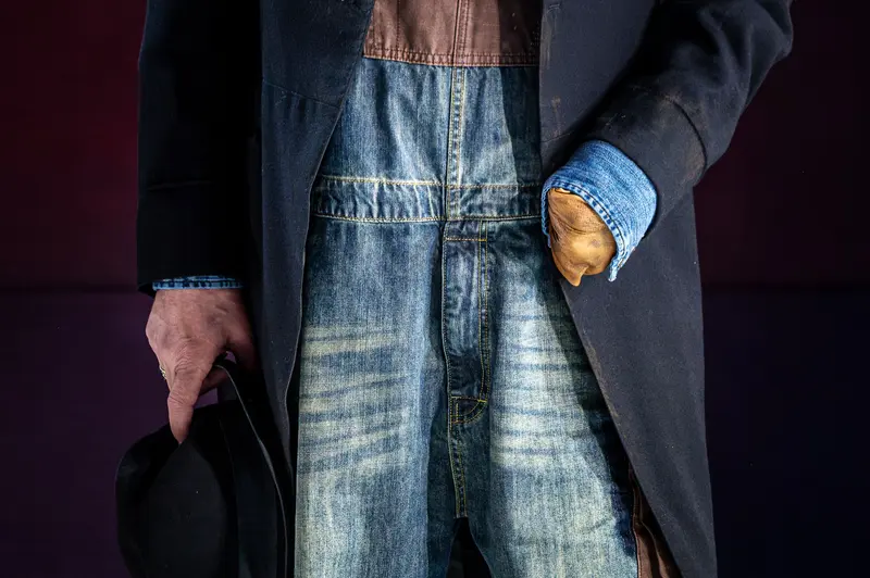 Denim and Overcoat: Textured Fashion Portrait in Monochromatic Setting