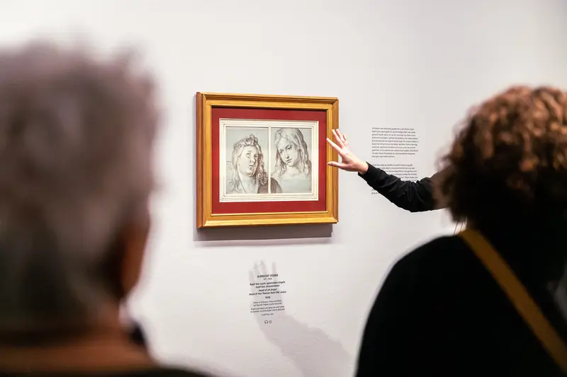 Visitors Examining Leonardo Dürer Sketches at Albertina Museum Exhibition
