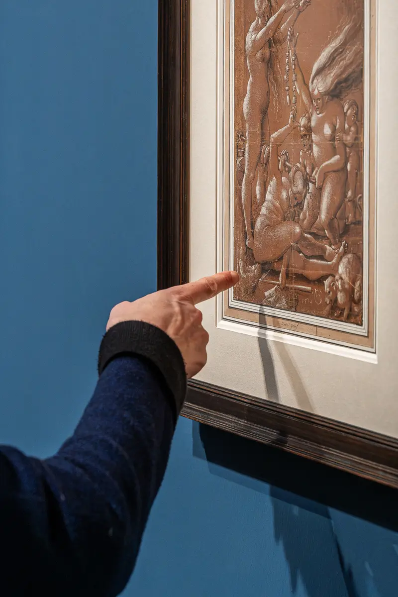 Visitor Examining Intricate Relief at Leonardo Dürer Exhibition, Albertina Vienna