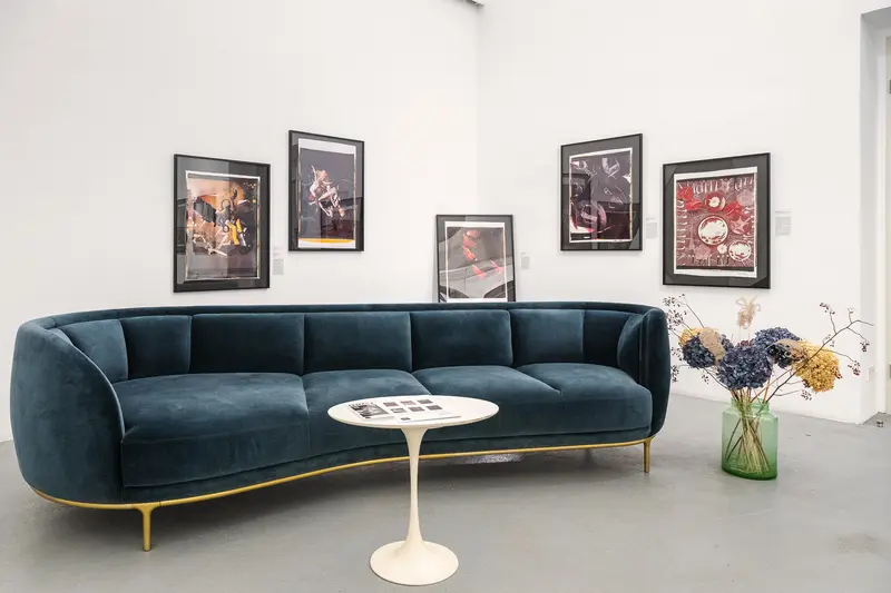 Blue Velvet Sofa with Modern Art in Minimalist Interior Design Setting