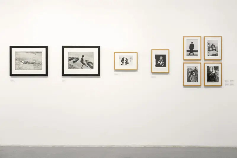 Gallery Wall Display of Black and White Photographic Prints in Minimal Setting