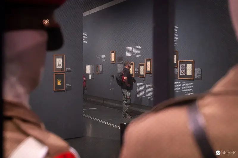 Visitor Exploring Exhibition on Allied Forces at Wien Museum