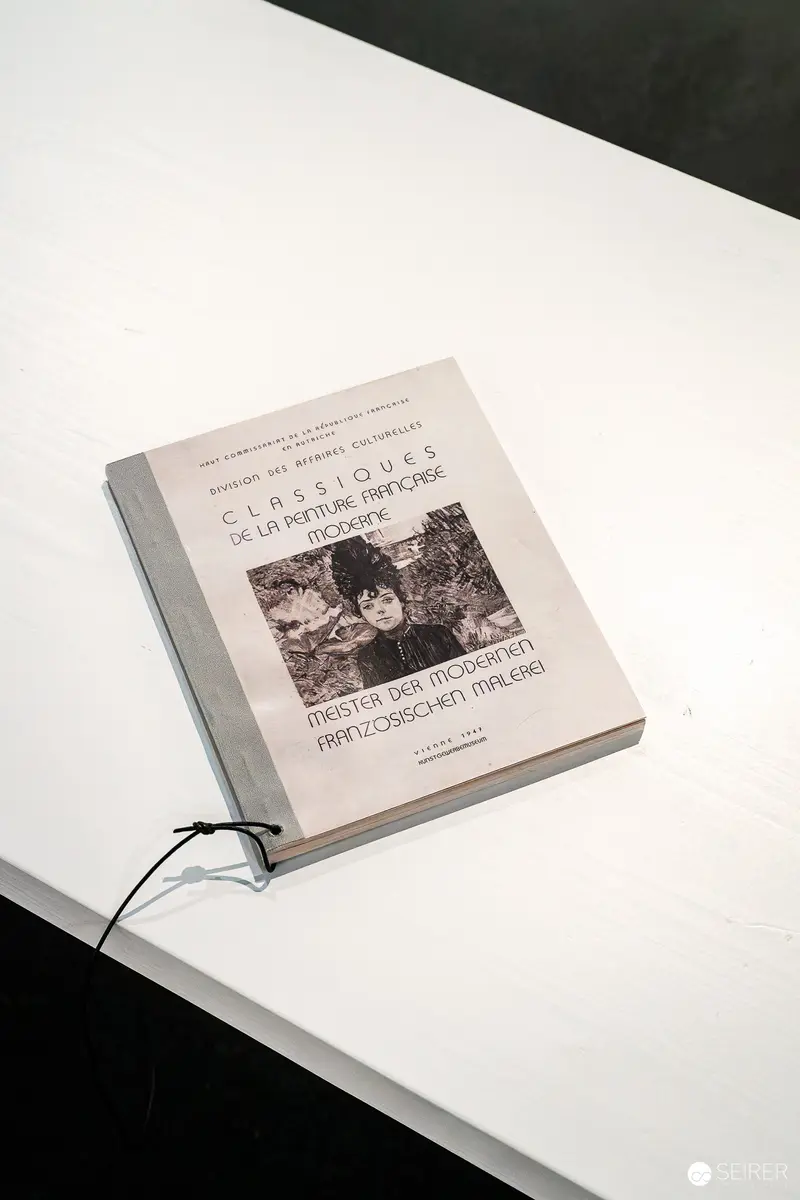 Exhibition Catalog on White Surface at Museum Display