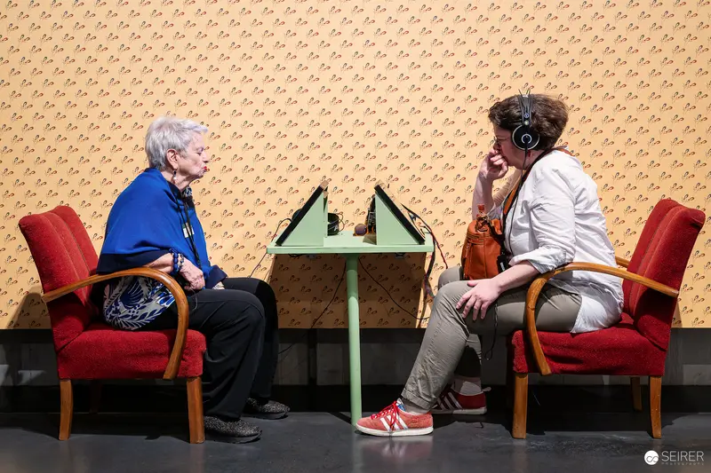 Two Generations Listen and Communicate at Interactive Exhibition Table