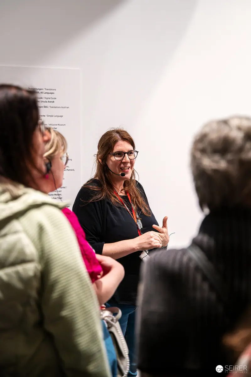 Exhibition Guide Discussing "Controlled Freedom" at Wien Museum Event