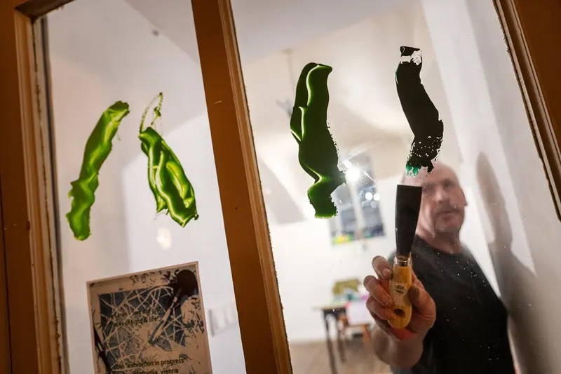 Experimental Art Installation: Green Paint Splash Captured in Mirror Reflection