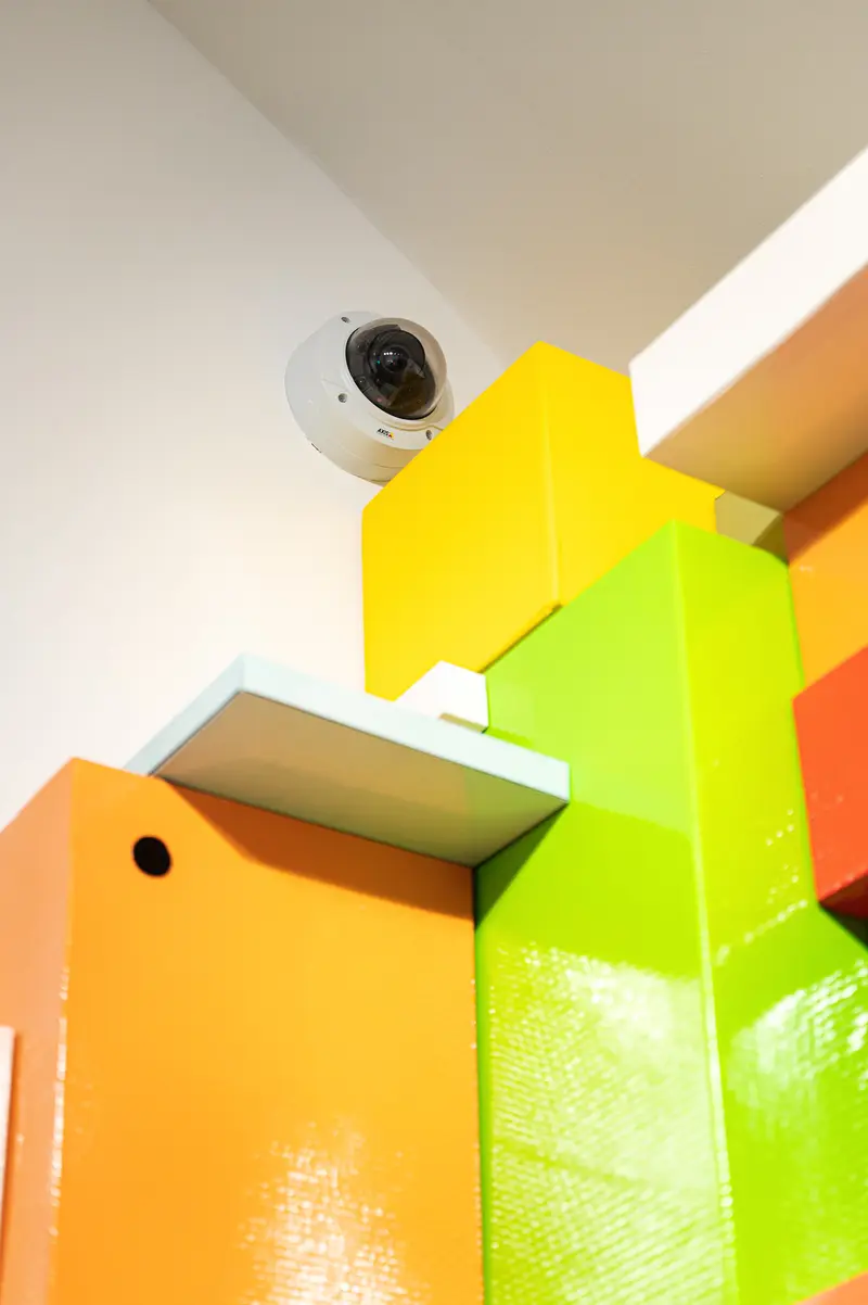 Colorful Storage Cubes with Mounted Surveillance Camera