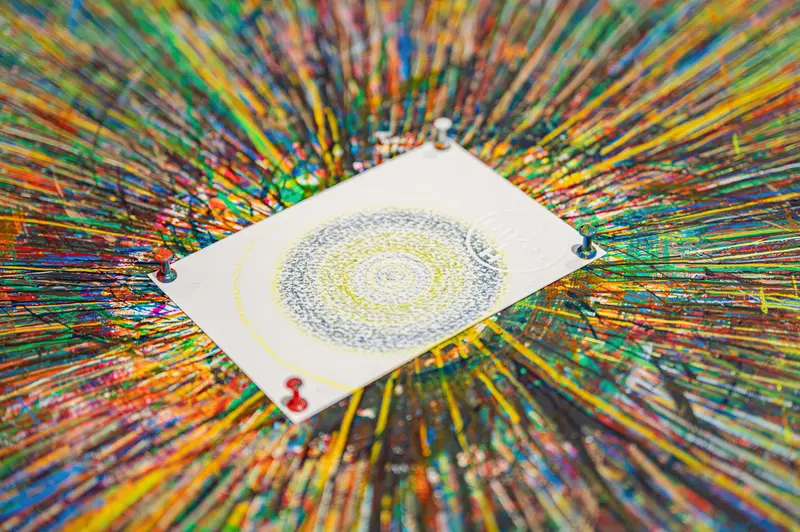 Mandala Playing Card Suspended in Vibrant Multicolored Paint Splash