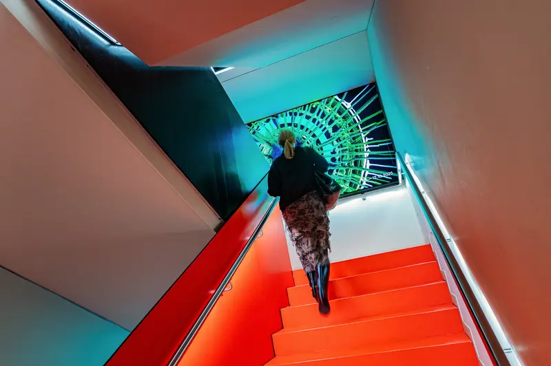 Vibrant Architectural Staircase with Geometric Color Blocking and Spiral Perspective
