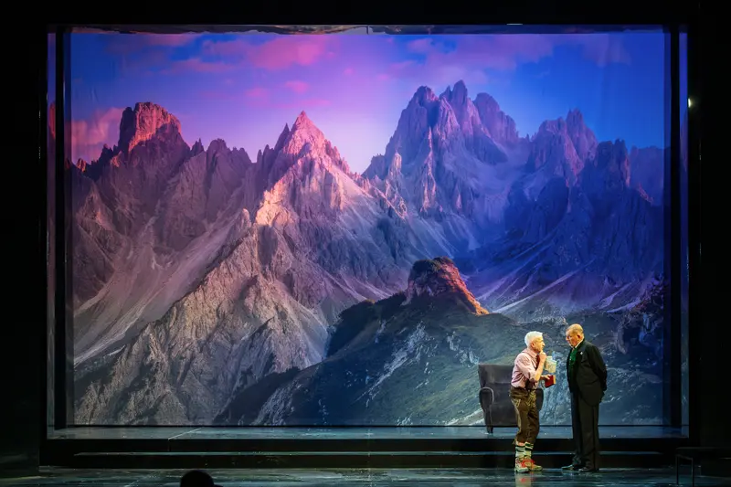 Actors on Stage with Dramatic Mountain Backdrop at Theater in der Josefstadt