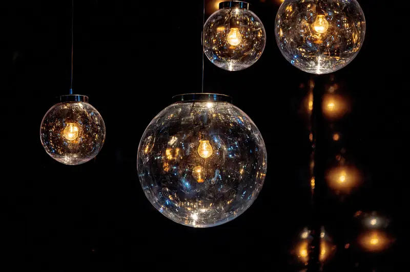 Illuminated Spherical Glass Pendant Lights with Golden Glowing Cores
