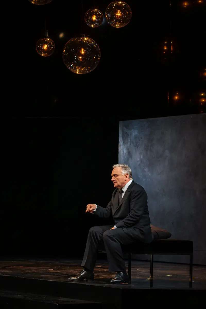 Actor Seated on Stage During Theatrical Rehearsal of "Das Weite Land"