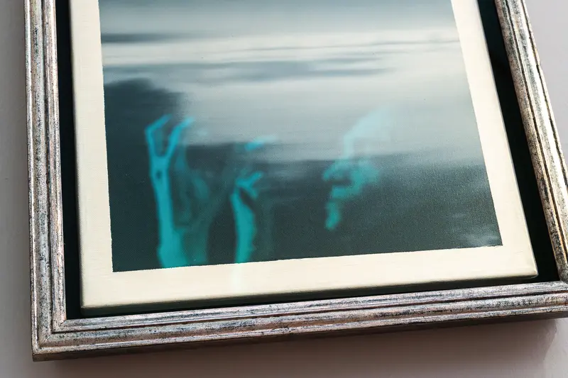 Ghostly Blue Hands Emerging from Blurred Photographic Frame