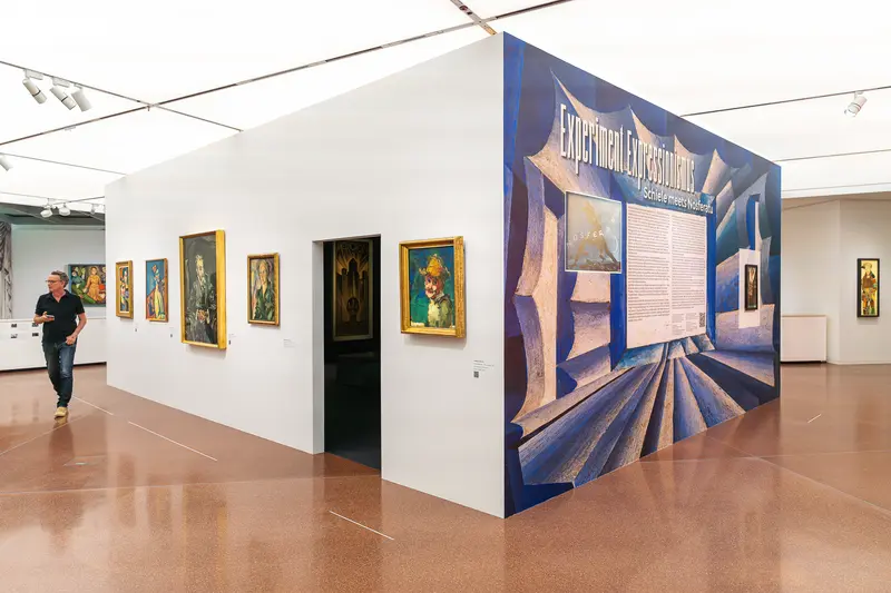 European Exhibition Gallery with Modernist Artwork and Graphic Display Wall