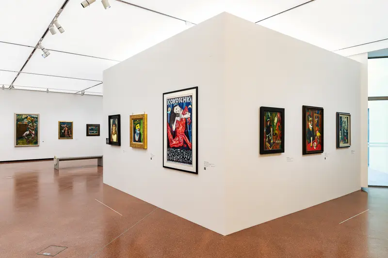 Art Gallery Interior with Modernist Paintings on White Walls