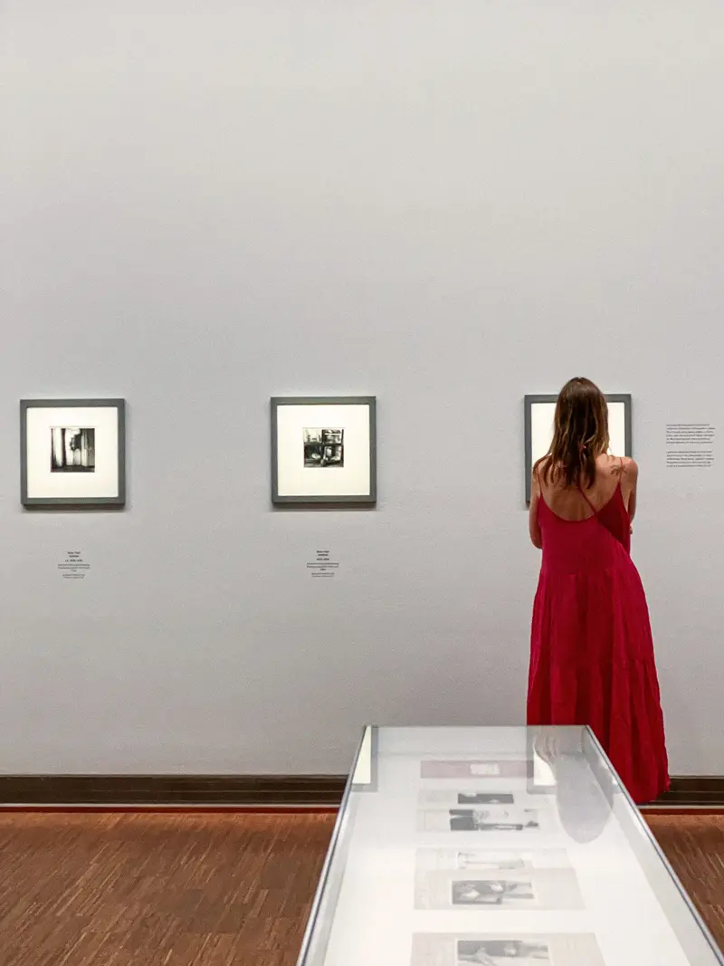 Visitor in Red Dress Studying Francesca Woodman Photographs at Albertina Museum