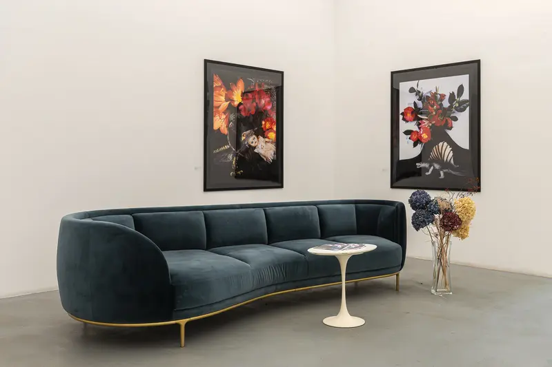 Modern Living Room with Velvet Blue Sofa and Abstract Floral Artworks