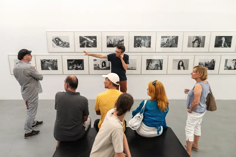 Exhibition Visitors Viewing Black and White Photography at Araki Show