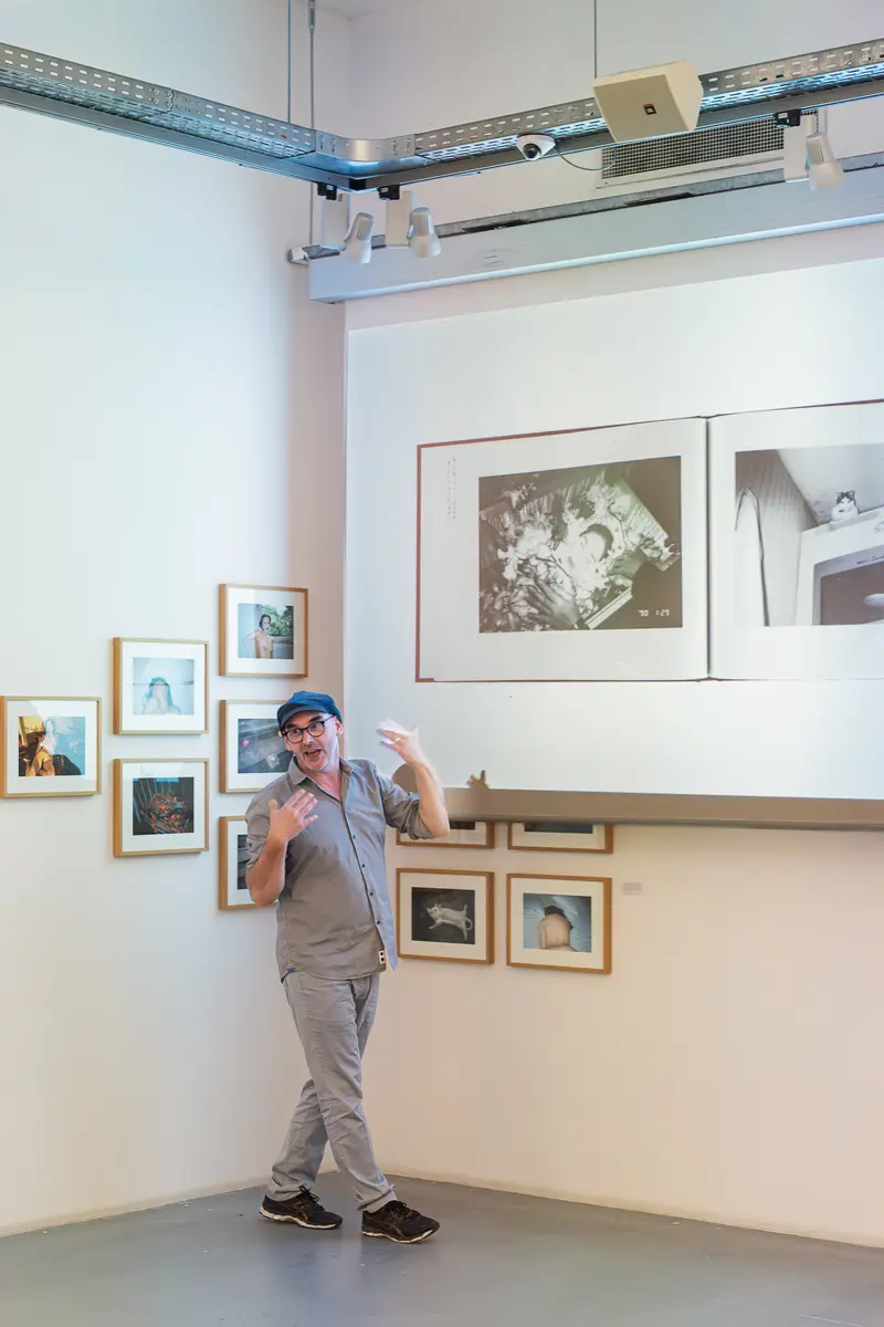 Exhibition View of "Araki" at Ostlicht Gallery with Visitor Posing