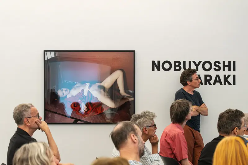 Nobuyoshi Araki Exhibition Visitors View Provocative Photographic Art at Ostlicht Gallery
