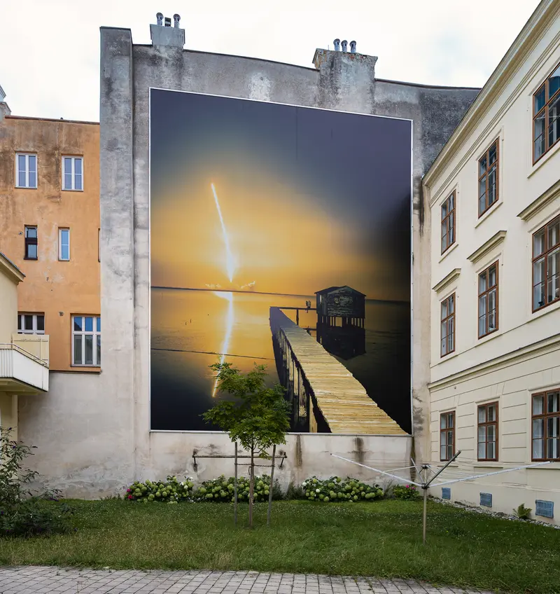 Sunset Pier Mural on Urban Building Wall in Photorealistic Style
