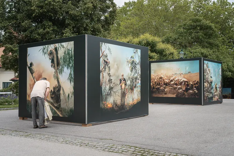 Outdoor Art Exhibition Cubes Displaying Historical Paintings and Scenes