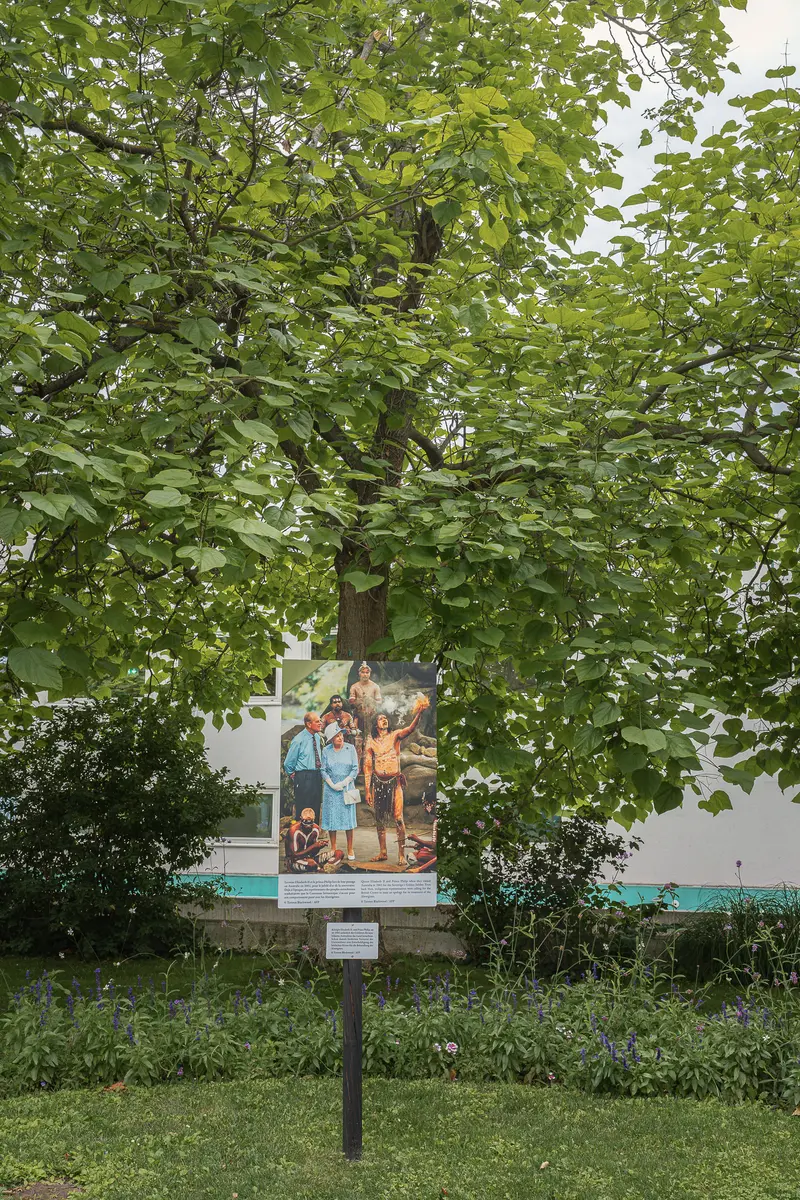 Information Panel Surrounded by Lush Green Foliage in La Gacilly Baden