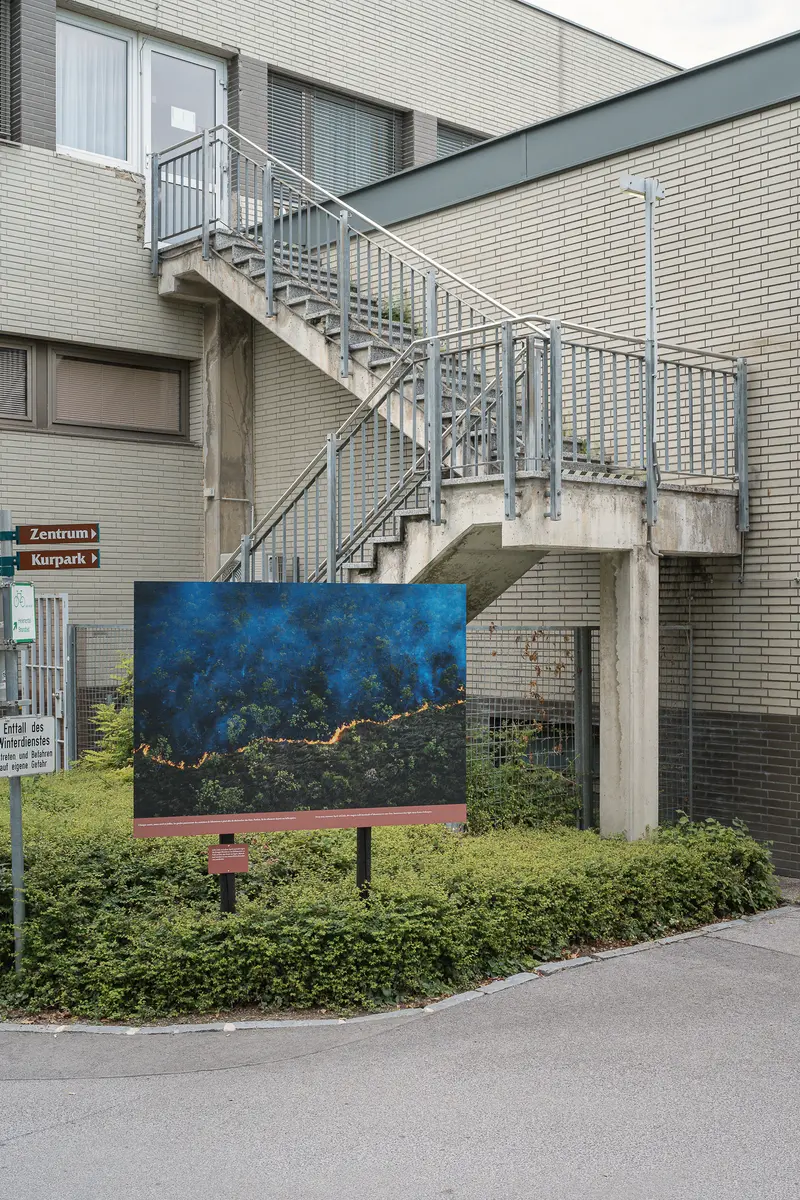 Urban Art Display: Blue Canvas Installed Near Architectural Staircase