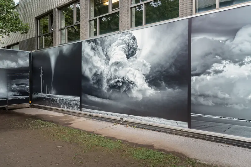 Dramatic Cloudscape Mural Installation on Urban Building Exterior
