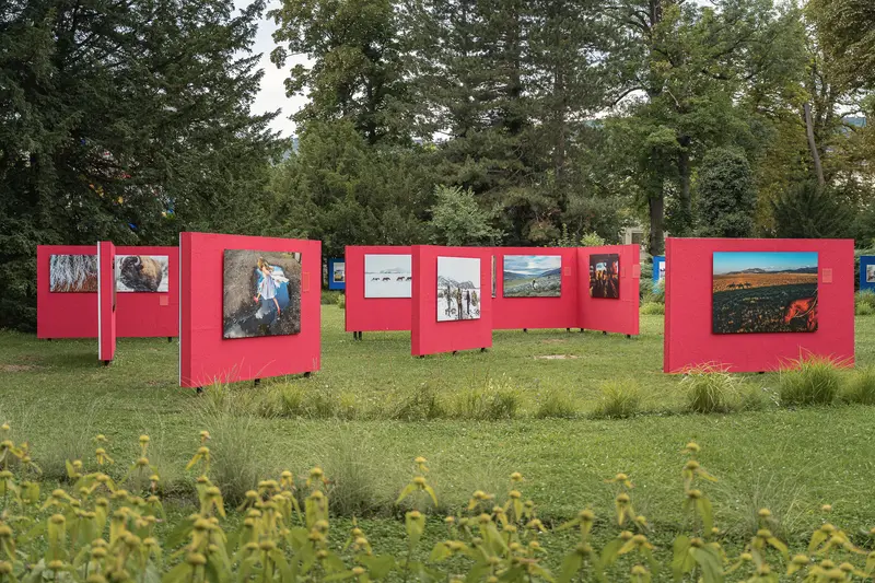 La Gacilly Baden Photo Exhibition: Outdoor Art Display with Red Panels