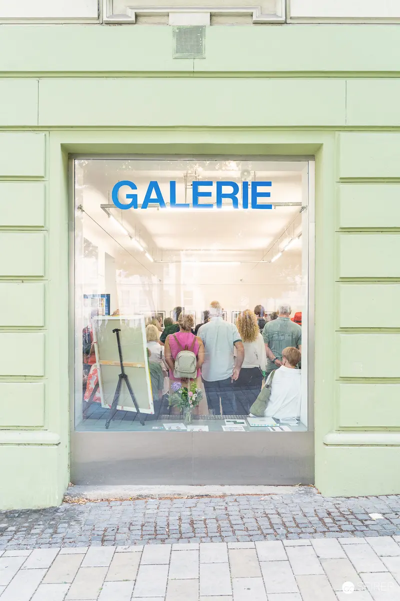Gallery Vernissage "Ladypower" Exhibition Opening Through Glass Storefront