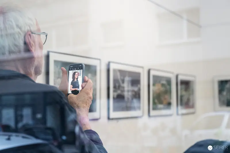 Visitor Capturing Portrait During "Ladypower" Exhibition Vernissage