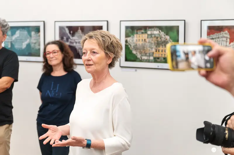 Ladypower Exhibition Vernissage with Curator in White at Gallery Opening