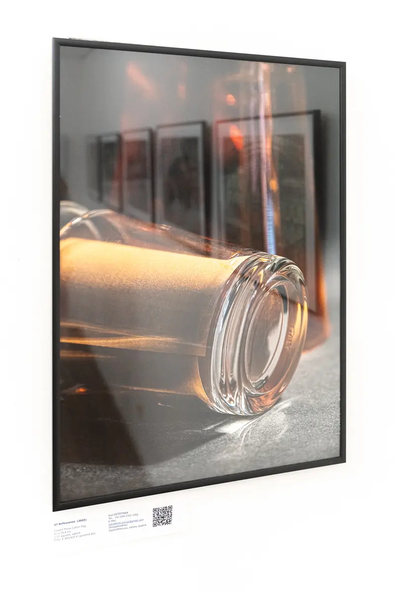 Glass Cylindrical Object with Reflective Surfaces in Gallery Exhibition