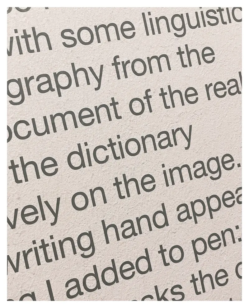 Linguistic Typography Closeup Showing Fragmented Text on Textured Paper