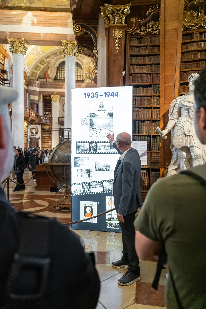 Dr. Hans Petschar Examining Historical Exhibition at Austrian National Library