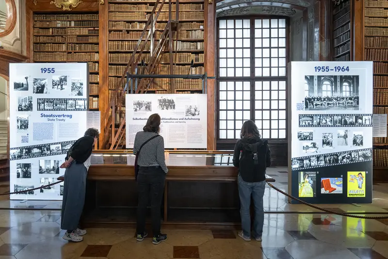 Visitors Exploring 1955-1964 Exhibition at Austrian National Library