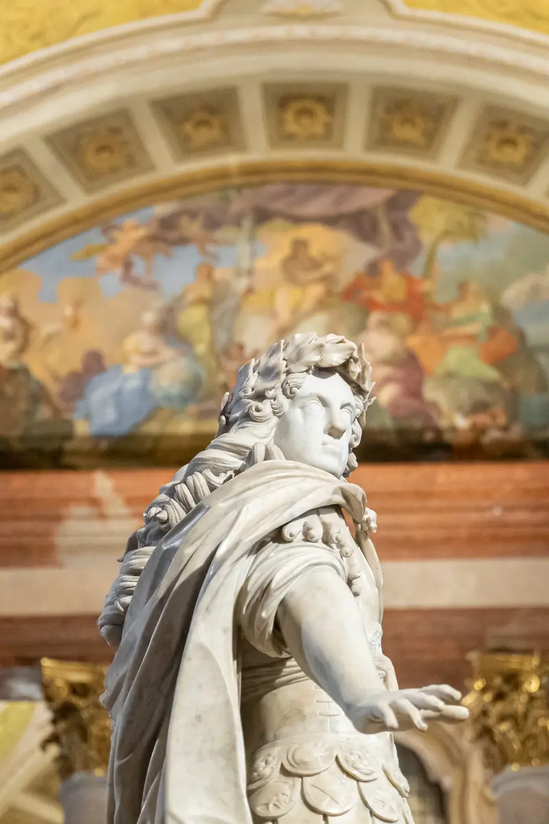 White Marble Statue with Ornate Architectural Fresco Backdrop