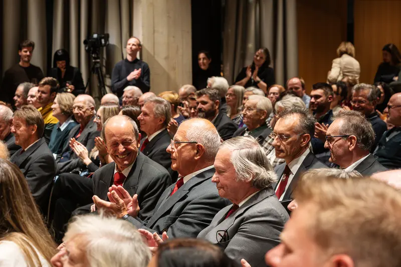 Attendees at Wien Museum Event "Fleisch" Discussing Cultural Exhibition