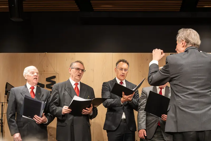 Choir Performance at Vienna Cultural Event with Conductor