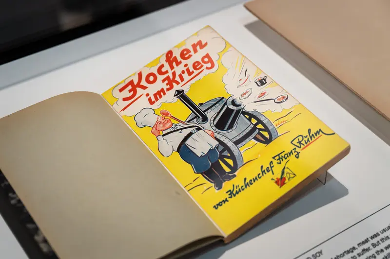 Vintage German Cookbook "Kochen im Krieg" Displayed on Open Book